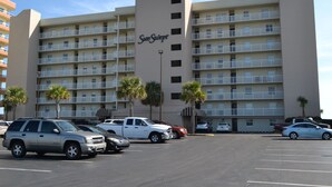 A multi-story hotel with a central sign reading 'Sun Seaport'. - Sunswept 107 by Liquid Life (Orange Beach)