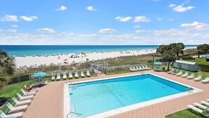 A pool area with a view of the beach and ocean. - Sunswept 304 by Liquid Life (Orange Beach)