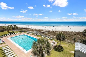 A pool area with a view of the beach and ocean. - Sunswept 408 by Liquid Life (Orange Beach)