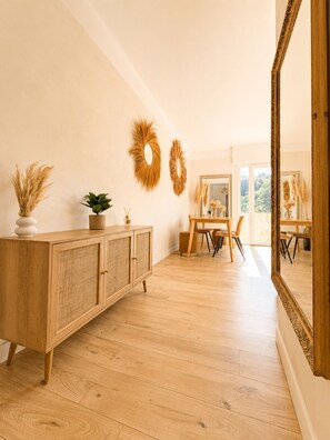 A room with a wooden cabinet, two wall-mounted mirrors, and a large mirror with an ornate frame. - Val de Cagnes Residence - Stylish and Peaceful – Sleeps 6 – Air Conditioning (Cagnes-sur-Mer)