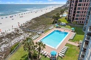 A resort with a swimming pool, beach access, and a view of the ocean. - Sunswept 701 by Liquid Life (Orange Beach)