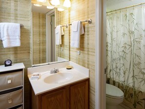 A bathroom with a sink, mirror, and towel rack. - Seaside Beach & Racquet 5915 by Liquid Life (Orange Beach)
