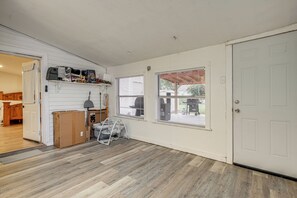 A room with a wooden floor, a white door, and a window with blinds. - Near San Antonio River Walk w/ Fenced Yard (San Antonio)