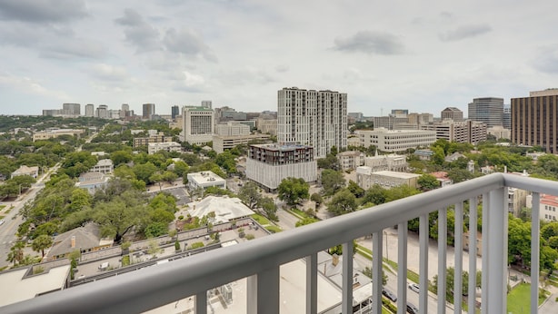 A cityscape with modern buildings, a mix of high-rise and low-rise structures, and a view of the streets below. - Explore Dtwn Austin! Luxe High-rise Escape w/ Pool (Austin)