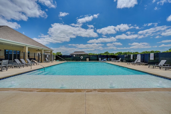 A rectangular swimming pool with a clear blue water surface, surrounded by lounge chairs and a covered area with a roof. - 2 Mi to Dtwn Crowley! 3-unit Rental (Crowley)