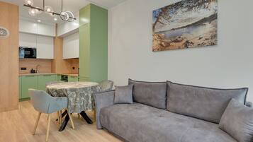 Apartment, Balcony, City View | Living room | Smart TV