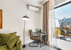 Apartamento, vistas a la ciudad | Zona de estar