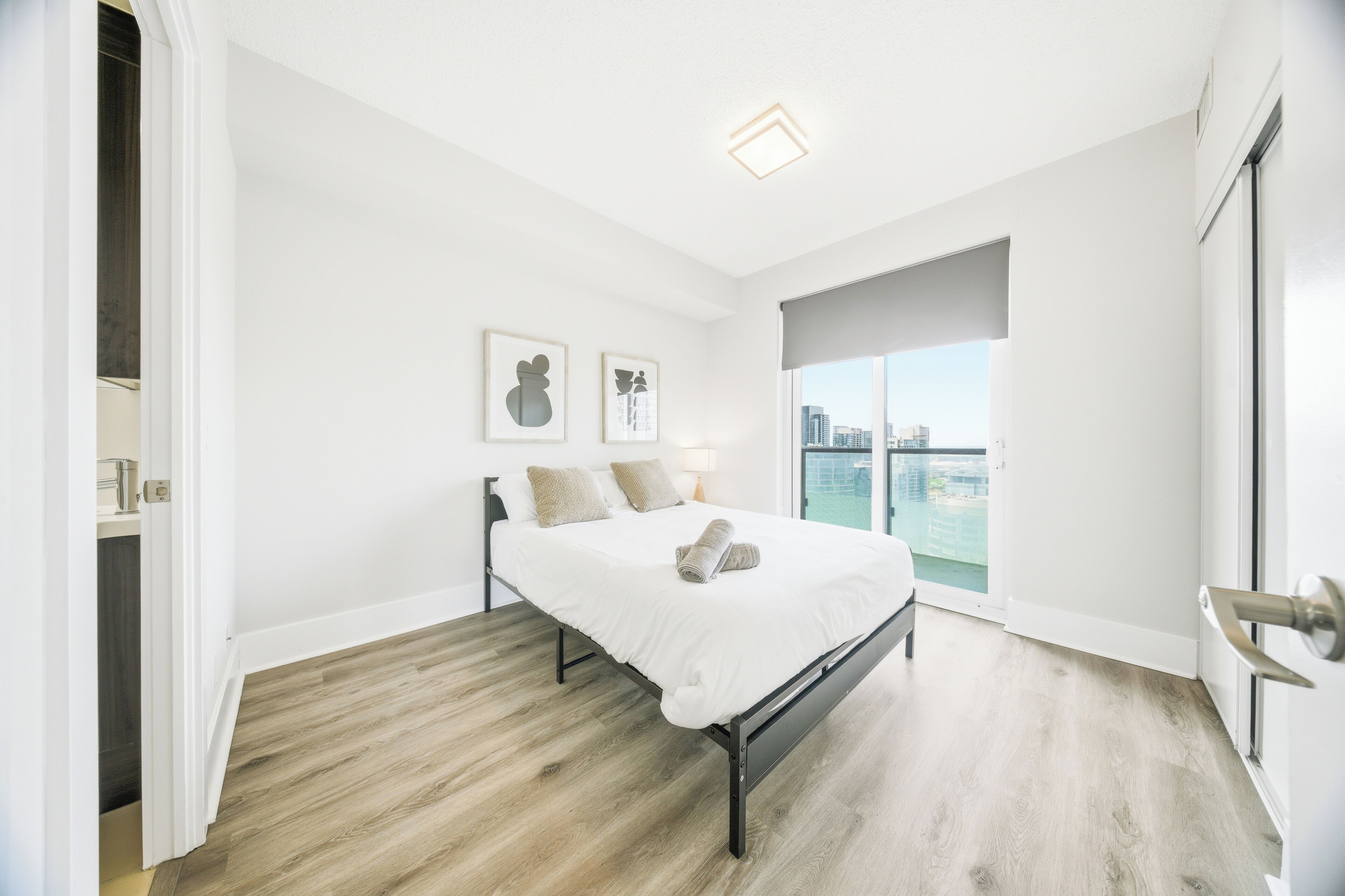 Premium bedding, desk, laptop workspace, blackout drapes
