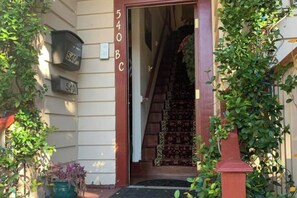 A house entrance with a number '540BC' on the door, a mailbox, and a staircase leading inside. - Modern Historic District duplex spacious and short walk to parks and restaurants (Savannah)