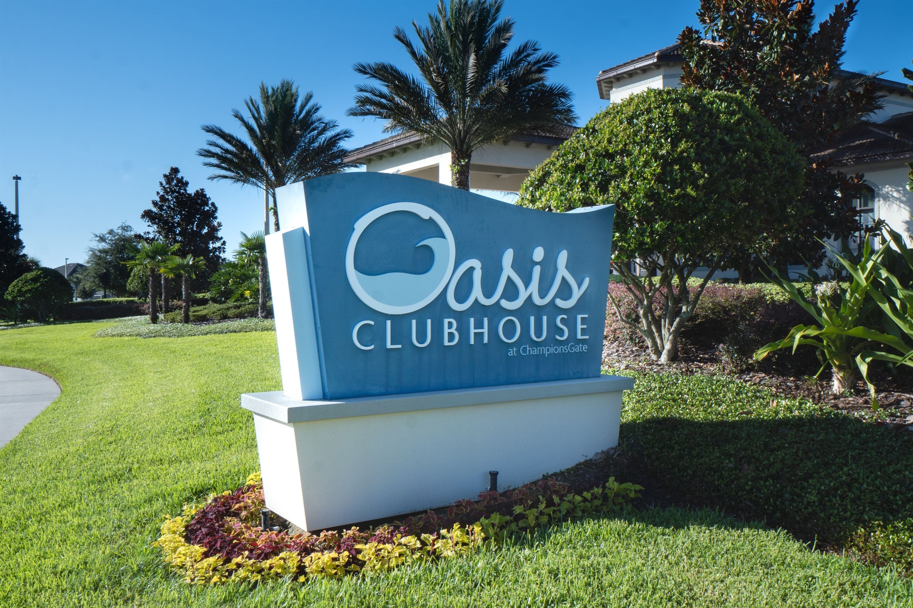 A sign for Oasis Clubhouse at ChampionsGate.