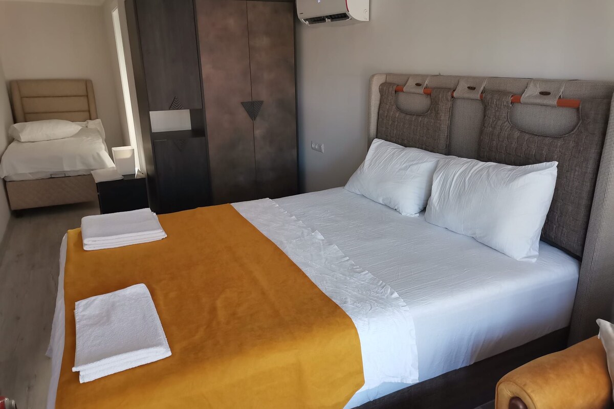 Habitación triple familiar, balcón, vistas al jardín