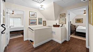A bedroom with a loft bed, a small desk area, and a window with blinds. - 3BR Stone Farm House, Parking, Grill, Laundry (Florence)
