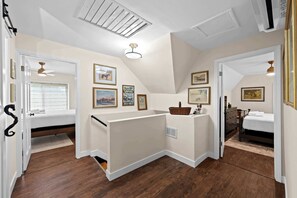 A bedroom with a loft bed, a small desk area, and a window with blinds. - 3BR Stone Farm House, Parking, Grill, Laundry (Florence)
