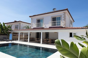 A two-story house with a swimming pool, outdoor seating, and a satellite dish. - Pera Locale Alaçatı (Cesme)