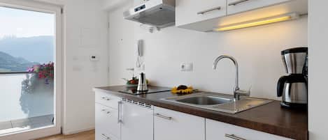 Coffee/tea maker, fridge, stovetop, dishwasher