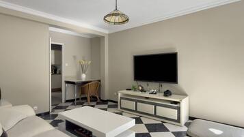 Una sala de estar moderna con un televisor de pantalla plana, un sofá blanco, una mesa de centro y piso a cuadros.