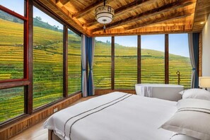 A bedroom with a large window, wooden ceiling, and a bed with white linens. - Longji B&B In Cloud (Guilin)