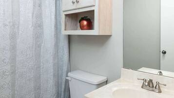 Shower, hair dryer, towels, shampoo