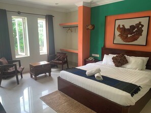 A hotel room with a bed, a desk, a chair, and a window. - Kaya Hotel  (Krong Siem Reap)