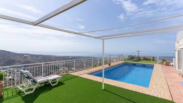 A rooftop pool with a clear view of the landscape.