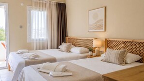 A hotel room with two beds, a large window with curtains, a headboard with a lattice design, and a framed picture on the wall. - Ciello Hotel (Bodrum)