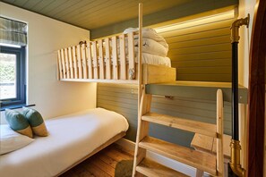 A bunk bed with a wooden ladder and a window with blinds. - Host Stay Casa Formentera (Scarborough)