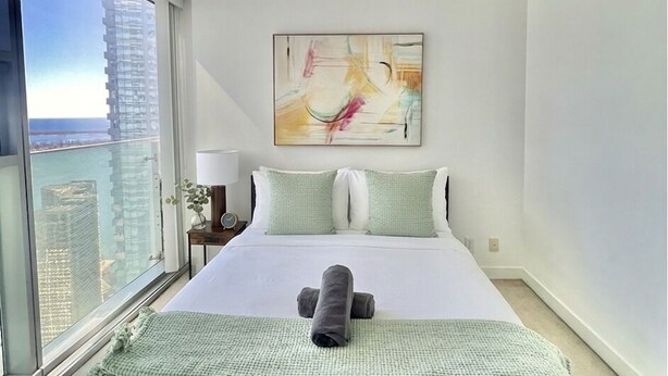 Desk, laptop workspace, blackout curtains, iron/ironing board - Wanderlust Suites (Toronto)