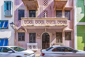 A building with a balcony, a door, and a window. - San Cristóbal View | 2BR in Old San Juan (San Juan)