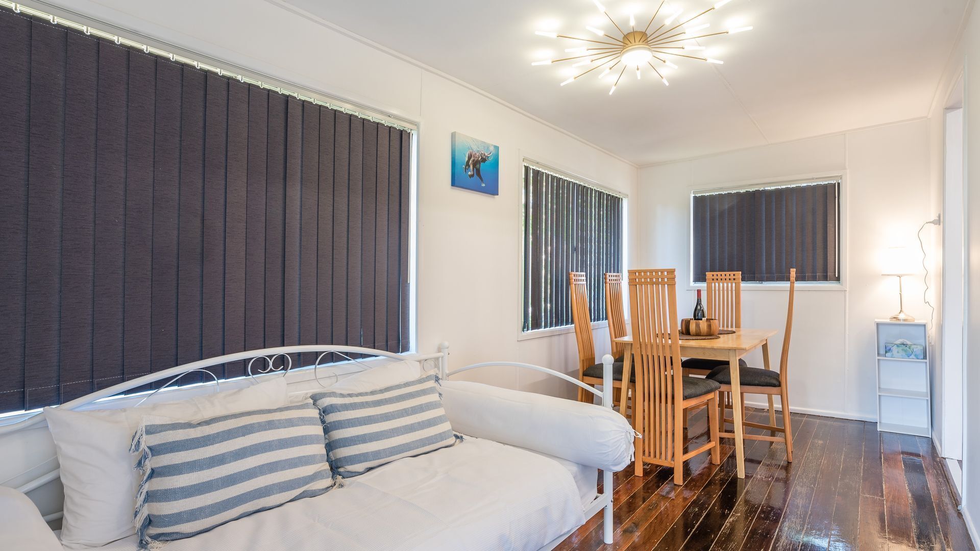 Bright living area with comfortable seating and a dining nook.