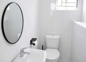 Shower, towels, soap, toilet paper