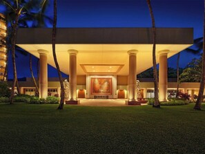 A hotel entrance with a large central artwork, palm trees, and a well-lit facade. - 3 Bedroom Villa at Marriott Kaua'i Lagoons (Lihue)