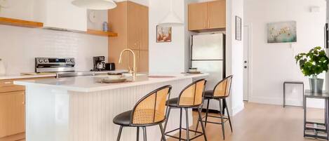 Coffee/tea maker, fridge, microwave, oven