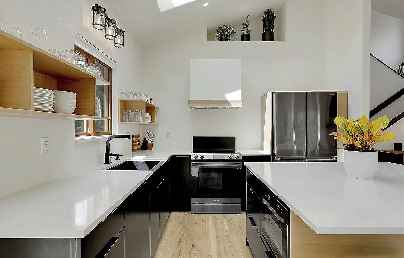 Seamlessly connected to the living area, this fully equipped kitchen and adjacent dining space make hosting effortless, whether you're whipping up a quick breakfast or settling in for a family dinner.