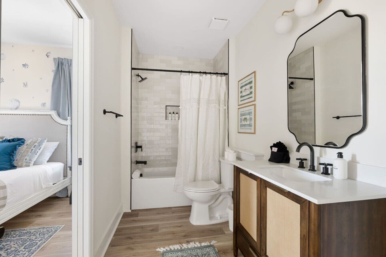 A modern bathroom with a shower, toilet, and vanity.