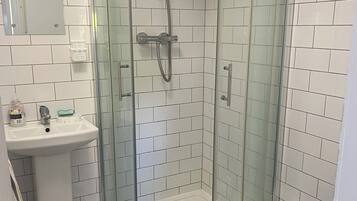 Shower, towels, soap, toilet paper