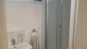 Shower, towels, soap, toilet paper