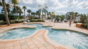 A pool area with multiple water features and lounge chairs. - 2BR Villa at Holiday Inn Club Vacations Cape Canaveral Beach Resort (Cape Canaveral)