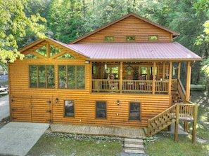 A log cabin with a porch, a deck, and a staircase leading to the upper level. - Time Out On The Toccoa | Blue Ridge, GA (Blue Ridge)