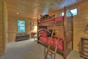 A bunk bed room with a ladder, a dresser, a desk, and a window. - Time Out On The Toccoa | Blue Ridge, GA (Blue Ridge)