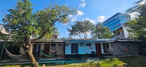 Family Room, Patio, Courtyard View | Exterior - The Avocado Inn (San Pedro Sula)