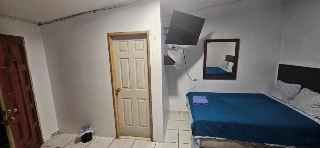 Family Room, Patio, Courtyard View | Desk, blackout curtains, iron/ironing board (on request), free WiFi