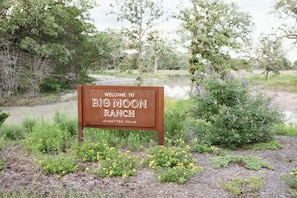 A welcome sign for Big Moon Ranch in Ledbetter, Texas.