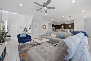 Living area - Renovated resort 5br themed pool, game room, game room, ambient pool lighting (Kissimmee)