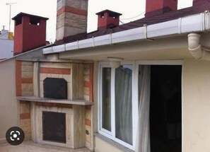Suite Deluxe, balcón | Jardines del alojamiento