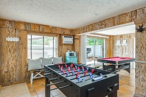 A room with a foosball table, a pool table, and a kitchenette area. - Island Oasis w/ Hot Tub, Walk to Shops and Dining (Marco Island)