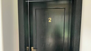 A black door with a gold number '2' and a door handle. - Double Self-Contained Rooms 2 (Johannesburg)