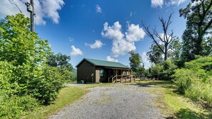 A small, single-story building with a gravel driveway leading to a wooden porch. - < 1 Mi to Dtwn Gatlinburg! Home w/ Hot Tub & Views (Gatlinburg)