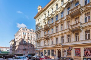 A multi-story building with classical architecture, featuring ornate balconies and large windows. - Bright Duplex Loft near Wenceslas Square (Prague 2)