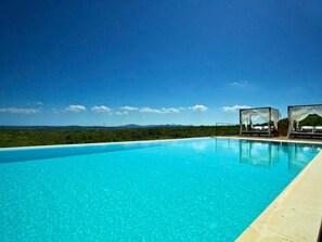 A clear blue swimming pool with a view of a green landscape and distant mountains. - Luxuriöses Landhaus für 16 Personen mit Pool und by Interhome (Sant Llorenç des Cardassar)