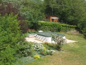 A residential property with a fenced backyard, a small shed, and a well-maintained lawn. - 2 Personen by Interhome (Labruguière)